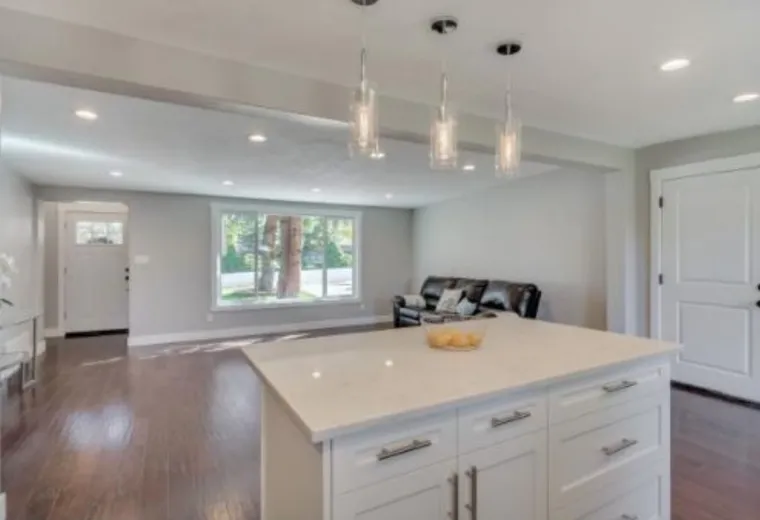Open remodeled main floor with kitchen island and living space